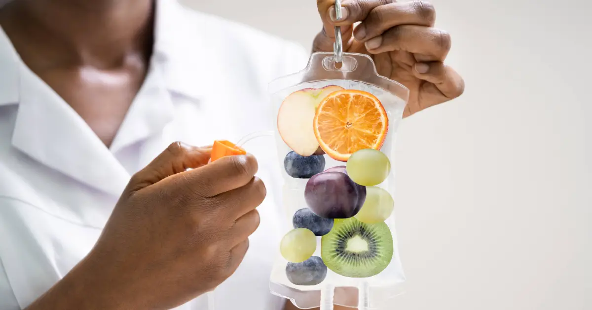 Vitamin IV Therapy bag filled with fruits held by a nurse in Charleston, SC