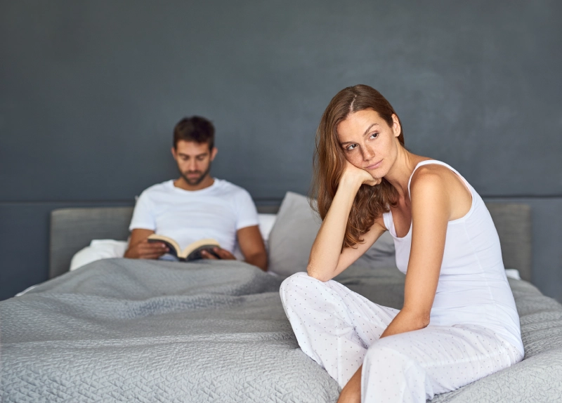 Healthcare provider consulting with a man and woman about hormone replacement therapy, symptoms, benefits, and personalized treatment options