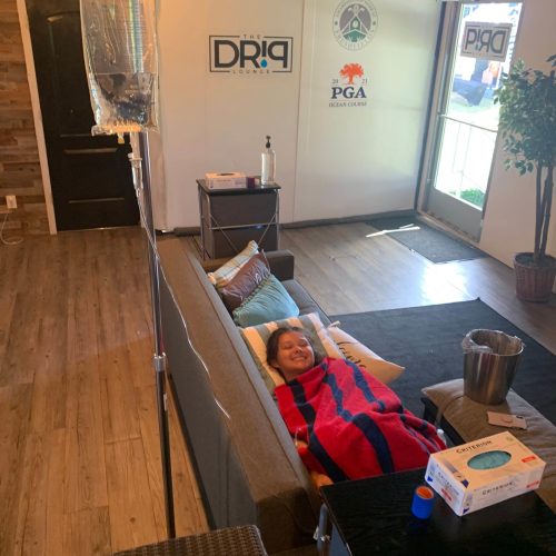 Smiling young patient resting in Charleston, SC | The Drip Lounge