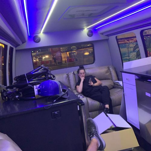 Young woman using phone in Charleston, SC | The Drip Lounge
