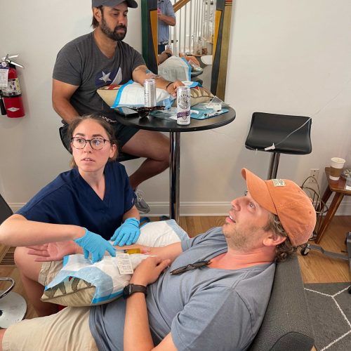 Doctor with patient looking at camera in Charleston, SC | The Drip Lounge