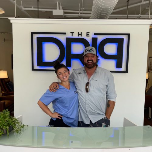 Smiling young woman with handsome man in Charleston, SC | The Drip Lounge